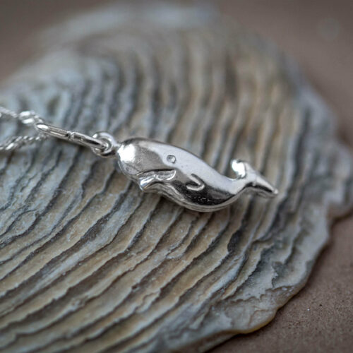Humpback whale calf necklace made of 925 sterling Silver for beach lifestyle and whale conservation activists who wish to support marine conservation and community empowerment in costa rica